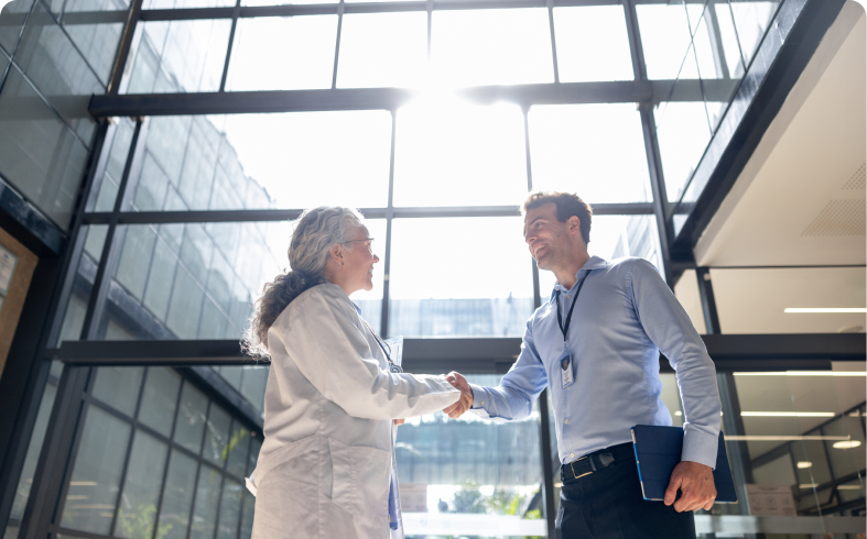 Professionals greeting each other in office